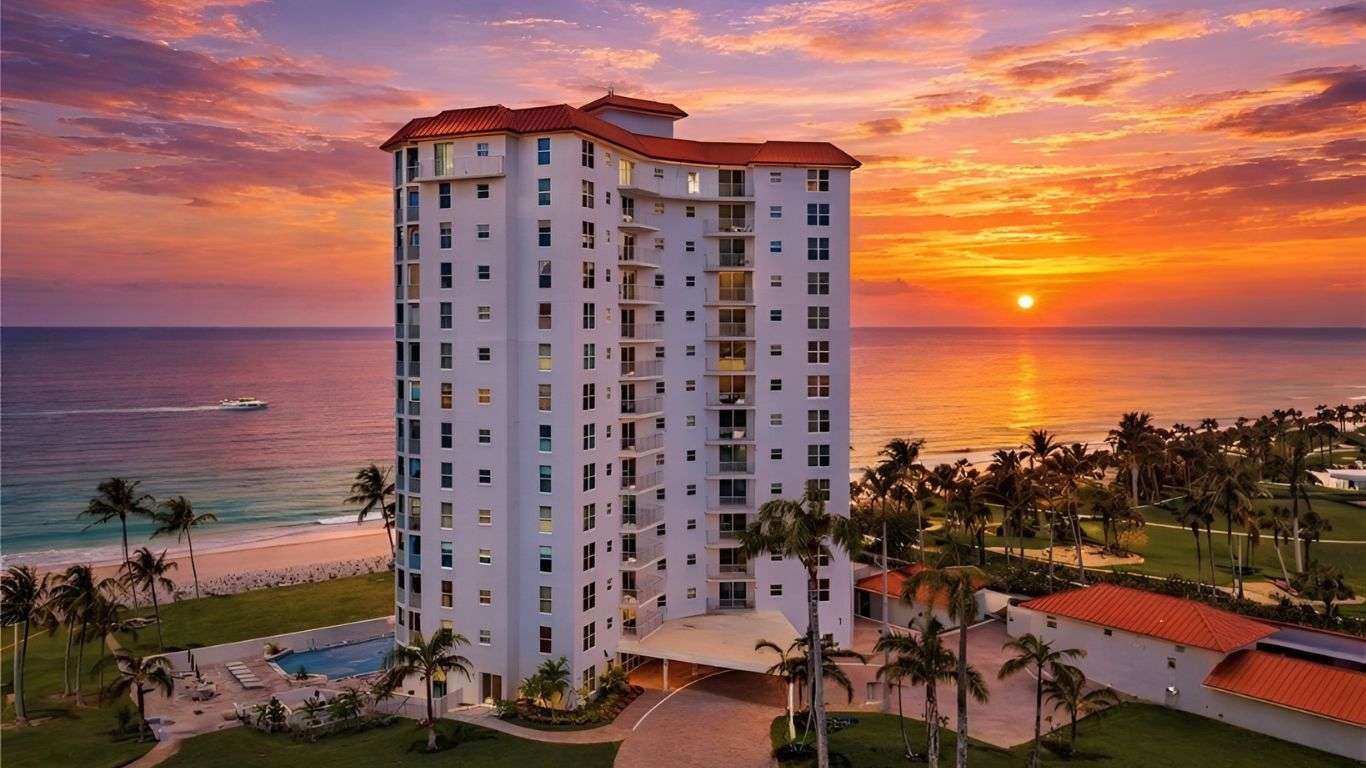 Stunning beach front condos with ocean views during a vibrant sunset.